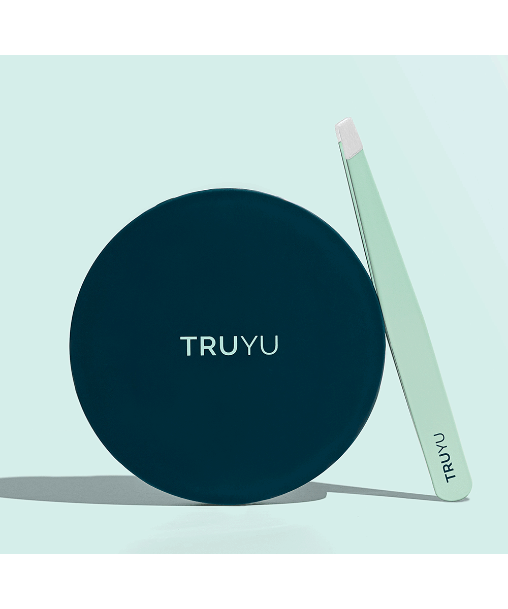 TRUYU Compact Mirror and Slant Tip Tweezer. Out of Packaging. Light blue background